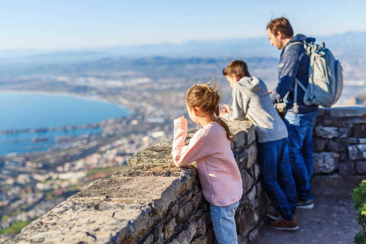 Family atop Table Mountain, Cape Town, Travel Insurance