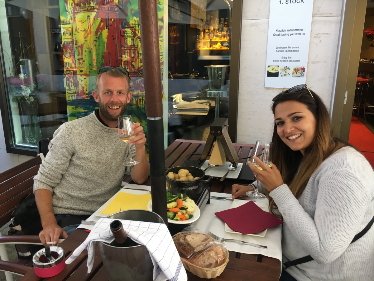 Engaged couple enjoy dinner and wine travel friendships