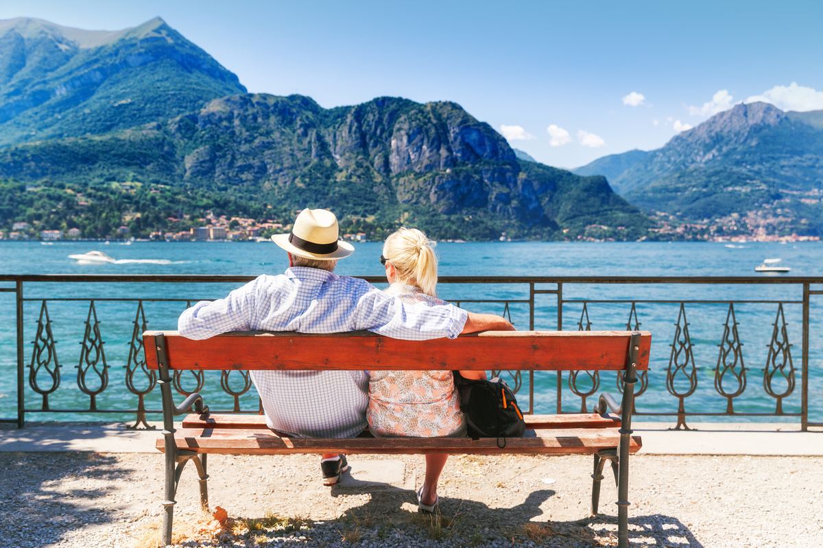 Older couple sit near Lake Como Italy Valentine's Day