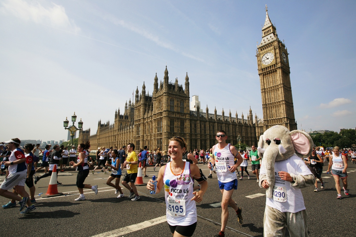 Runners near Big Ben and dressed up for the London Marathon, epic marathons