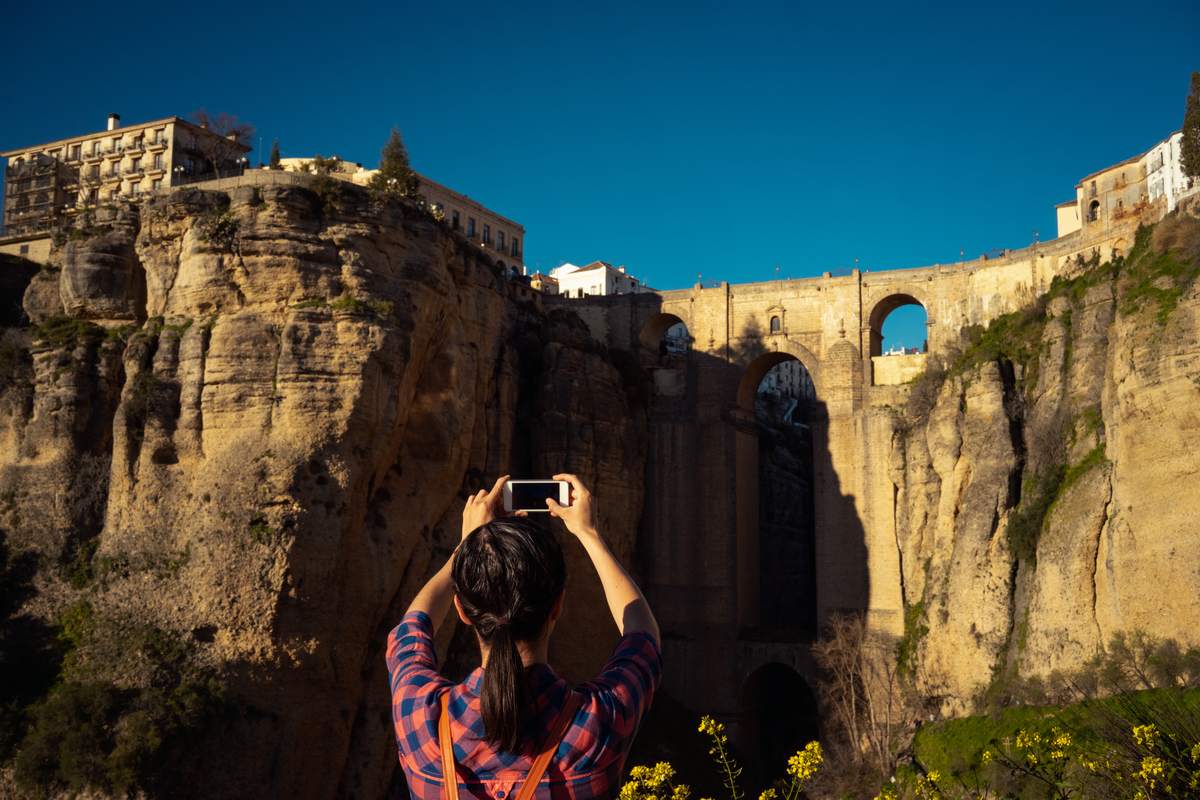 Woman photographs Puente Nuevo Ronda Spain